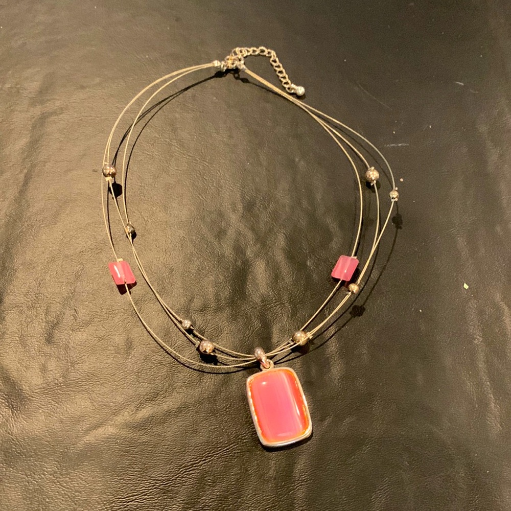 Costume necklace with pink beads and pendant and matching earrings